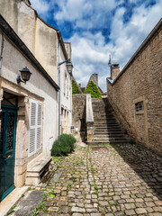 Fototapeta na wymiar Empty streets of the medieval city of Beaune in Burgundy. The stormy sky