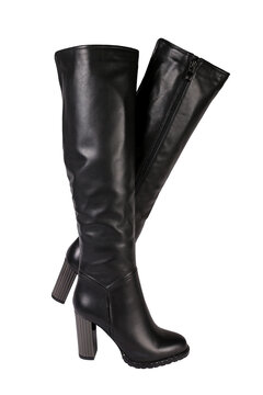 Black women's leather boots on a white background. Women's classic fashion spring and autumn high heel shoes
