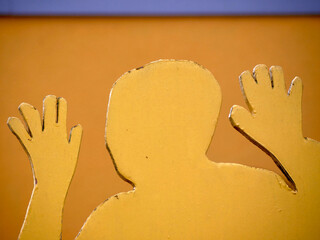 yellow cardboard man holding high hands like a goalkeeper