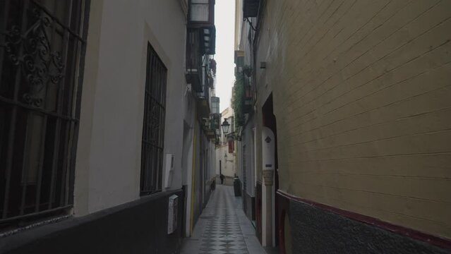 Beautiful Narrow Alley Street in Old Town of Sevilla Seville Spain During The Day