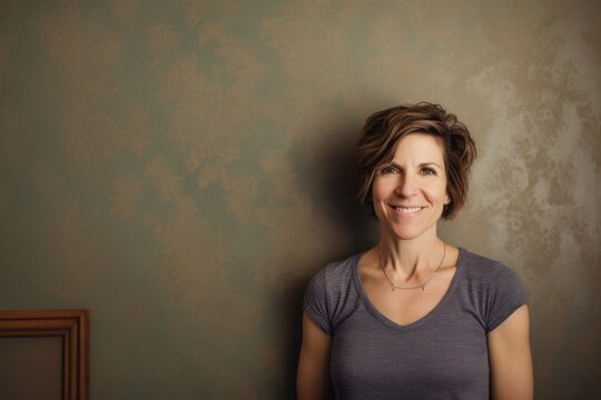 Portrait of a beautiful middle-aged woman with short hair smiling at the camera