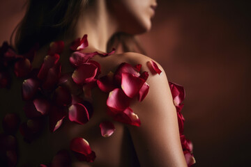 Red petals grew on the shoulder of a beautiful young woman. Concept for beauty product presentation. Photorealistic illustration generative AI.