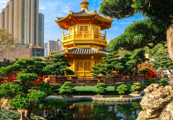The Pavilion at Nan Lian Garden, Diamond Hill, Hong Kong, with buildings in the background, the Chinese characters mean this is ‘The Pavilion of Absolute Perfection'