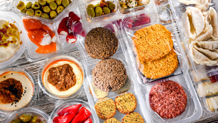 Variety of prepackaged food products in plastic boxes