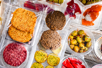 Variety of prepackaged food products in plastic boxes