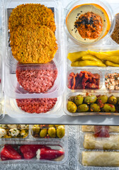 Variety of prepackaged food products in plastic boxes