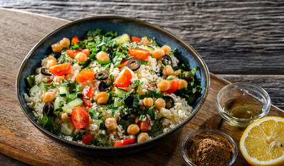 A plate of couscous served with vegetables and chickpeas