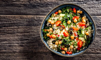 A plate of couscous served with vegetables and chickpeas