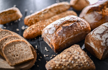 Assorted bakery products including loaves of bread and rolls