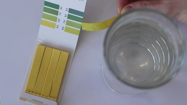 Measuring water pH with test strips