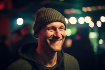Obraz premium Portrait of a smiling man in a hat at a music festival