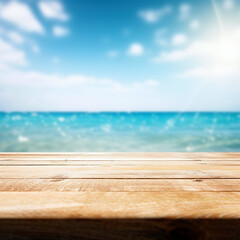 Obraz na płótnie Canvas Wood table top on blur sparkling sea water