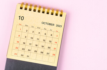 The October 2023 Monthly desk calendar for 2023 year made from craft paper on beautiful background.