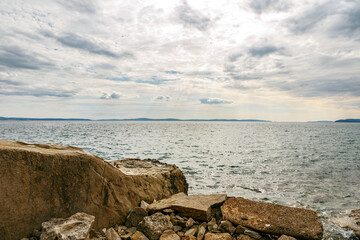 Fototapeta na wymiar View at the adriatic sea from the coastside near Stobrec, Dalmatia, Croatia, in early spring