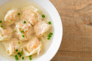 Fototapeta na wymiar shrimp dumpling soup in white bowl