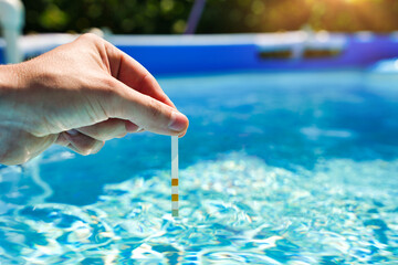 Swimming pool test water on ph and chemical balance.