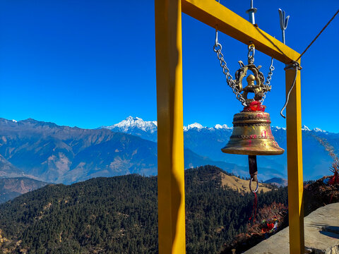 Beautiful view of the mountain temple bell of Kalinchowk Nepal named Bhagwati with the view of snow capped mountains in the background