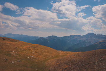 Fototapeta premium A picturesque landscape of a hiking path in the Alps in the Queyras valley (Hautes-Alpes, France)