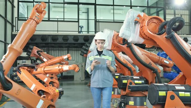 A female auditor Inspected to account for the company's robot assets that were brought to the warehouse before delivering to customers.