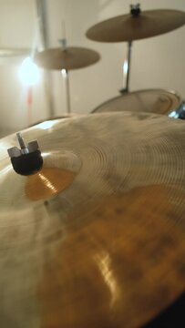 close-up of a drum set cymbal, vertical video