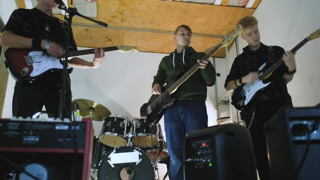 teen band rehearsal in garage