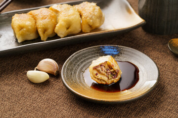 Special Chinese food raw fried dumplings on a monochrome background