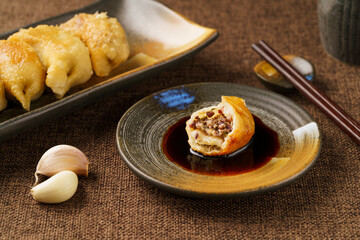 Special Chinese food raw fried dumplings on a monochrome background