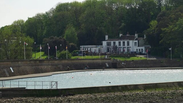 The public bathing lake at Clevedon, near Bristol, with pub