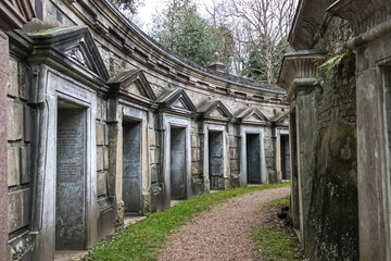 Highgate Cemetery famous for it's romantic victorian architecture and gothic tombstones, prominent figures buried here such as Karl Marx and Douglas Adams - obrazy, fototapety, plakaty