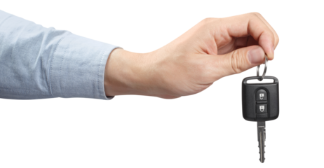 Hand holding a car key, cut out