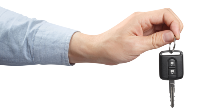 Hand holding a car key, cut out - Powered by Adobe