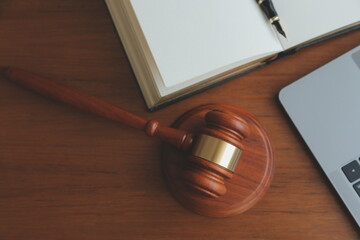 Business and lawyers discussing contract papers with brass scale on desk in office. Law, legal services, advice, justice and law concept picture with film grain effect