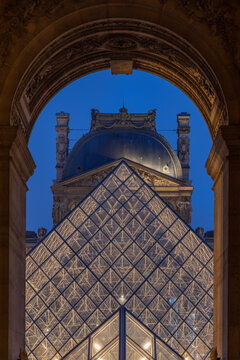 Paris, France, April 2023. The Louvre glass Pyramid at Night. Illuminated glass pyramids at the Louvre, Paris.