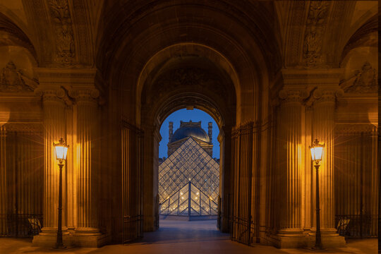 Paris, France, April 2023. The Louvre glass Pyramid at Night. Illuminated glass pyramids at the Louvre, Paris.
