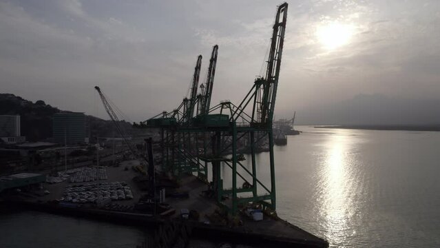 Shipping cranes at boat dock - not in use - aerial view on overcast day