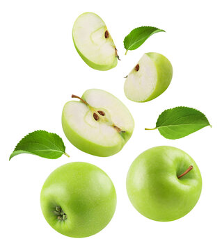 Apples isolated. Levitation of ripe green apples, apple halves and slices on a transparent background.