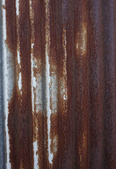 The texture of an old and rusted green steel plate is used as a design background