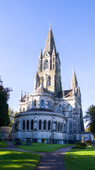 Fototapeta na wymiar View of the old Christian Cathedral of the 19th century in the Irish city of Cork. Christian religious architecture in the Neo-Gothic style. Cathedral Church of St Fin Barre.