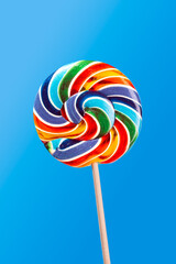 Colorful lollipop on blue background