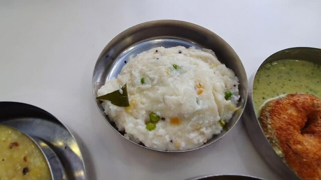 A view of healthy South Indian breakfast food varieties served on small plates