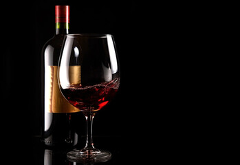 Naklejka na ściany i meble Bottle and glass with red wine