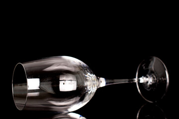 One crystal wine glass, macro, isolated on black background.