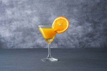 Orange juice on table isolated on grey colour background