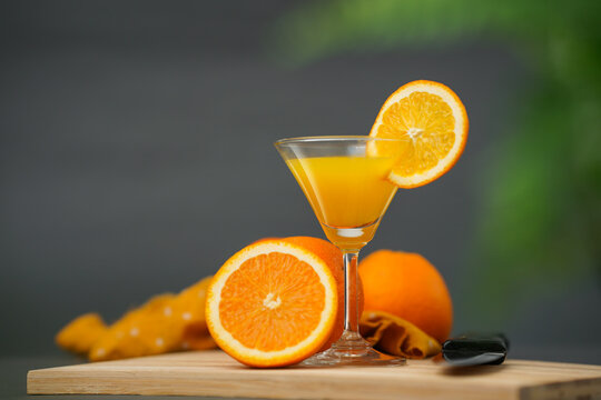 Orange juice in a beautiful glass, fresh and healthy cooldrinks image, fresh juice with sliced orange fruit