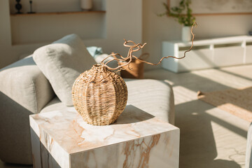 Close-up of a Wicker vase on a coffee table in a living room