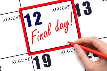 Hand writing text FINAL DAY on calendar date August 12.  A reminder of the last day. Deadline. Business concept.