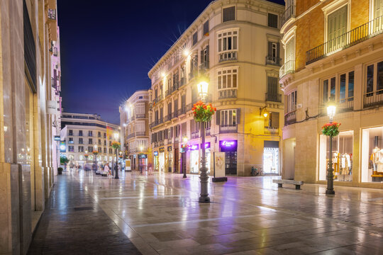 Calle Larios at night - famous pedestrian and shopping street - Malaga, Andalusia, Spain