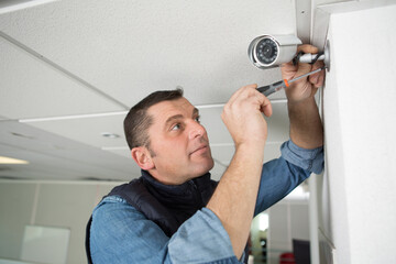 technician or contractor with cctv security camera
