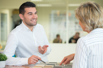 Fototapeta na wymiar man and woman working on desk in creative office