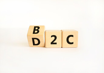 B2C or D2C symbol. Concept words B2C business to consumer D2C direct to consumer. Beautiful white table white background. B2C business to consumer D2C direct to consumer concept. Copy space.